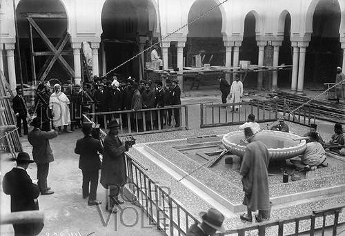 Roger-Viollet | 214143 | An Indian delegation visiting the Paris Mosque under construction with Moroccan Prime Minister Ben Ghabrit (left). 1924. | &copy; Maurice-Louis Branger / Roger-Viollet
