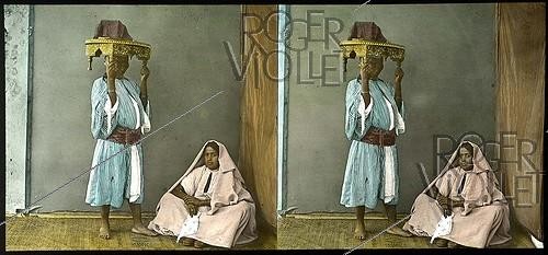 Roger-Viollet | 369821 | Black woman carrying the presents of a future bride in Tangier (Morocco), around 1885. | &copy; Léon & Lévy / Roger-Viollet