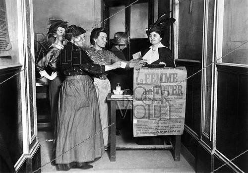 Roger-Viollet | 827135 | Feminist demonstration during legislative elections. Women  voting  at an improvised polling station. Paris, 1914. | &copy; Maurice-Louis Branger / Roger-Viollet