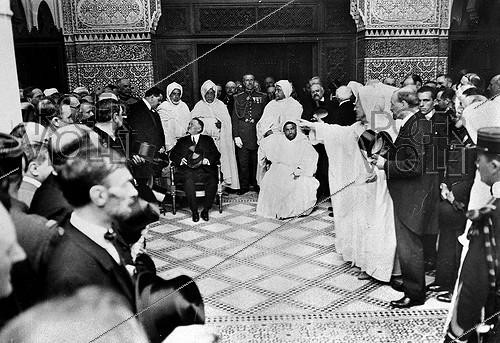 Roger-Viollet | 212660 | Gaston Doumergue (1863–1937), President of the French Republic, and the Sultan of Morocco, Youssef ben Hassan (1882–1927), seated in the center, at the inauguration of the Paris Mosque (5th arrondissement), July 15, 1926. | &copy; Albert Harlingue / Roger-Viollet