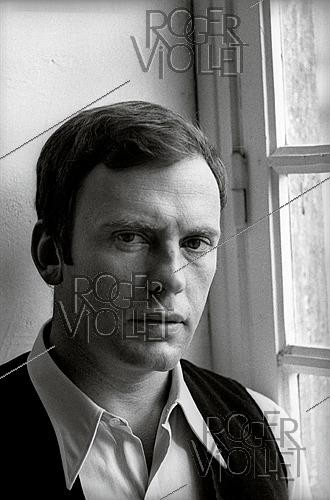 Roger-Viollet | 1644147 | Jean-Louis Trintignant (1930–2022), French actor, director and racing driver, 1960s. Photograph by Philippe R. Doumic (1927–2013). | &copy; Philippe R. Doumic / Roger-Viollet