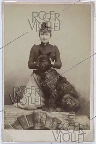 Roger-Viollet | 449913 | Louise Weber (known as La Goulue, 1866-1929), French cancan dancer, with a dog, around 1889. Anonymous photograph. Paris, Bibliothèque Marguerite Durand. | &copy; Bibliothèque Marguerite Durand / Roger-Viollet