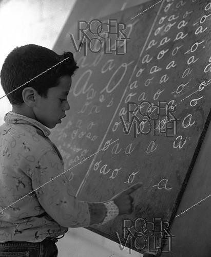 Roger-Viollet | 689123 | School built by the soldiers for the children of the village of M'Zaourat, Mascara Area, during the Algerian War of Independence. Algeria, Summer 1961. | &copy; Jean-Pierre Laffont / Roger-Viollet