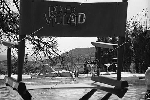 Roger-Viollet | 388842 | Shooting of  La Piscine  by Jacques Deray. Alain Delon. France, 1968. Photograph by Georges Kelaïditès (1932-2015). | &copy; Georges Kelaïditès / Roger-Viollet