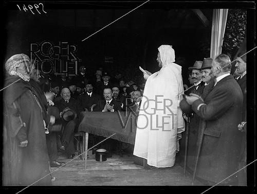 Roger-Viollet | 1312717 | Speech of Si Kaddour Benghabrit (1868-1954), Algerian statesman from the Ministry of Foreign Affairs, on the occasion of the laying of the foundation stone, of the Muslim Institute and the Grand Mosque of Paris, place du Puits-de-l'Ermite (5th arrondissement). Wednesday 1st March 1922. Photograph from the French newspaper  Excelsior . | &copy; Excelsior - L'Equipe / Roger-Viollet