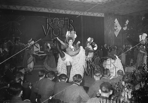 Roger-Viollet | 830845 | War 1939-1945. German soldiers attending a show of cancan. Paris, September 1942. | &copy; LAPI / Roger-Viollet