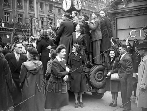 Roger-Viollet | 1422008 | World War II. Celebrating the French Army. Paris, on April 2nd, 1945. Photograph from the collections of the French newspaper  France Soir . Bibliothèque historique de la Ville de Paris. | &copy; Fonds France-Soir / BHVP / Roger-Viollet