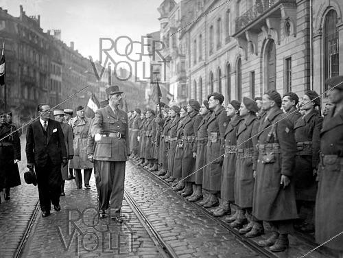 Roger-Viollet | 1421879 | World War II. Charles de Gaulle (1890-1970), French General and statesman, reviewing troops in Strasbourg (France), on February 12, 1945. Photograph from the collections of the French newspaper  France Soir . Bibliothèque historique de la Ville de Paris. | &copy; Fonds France-Soir / BHVP / Roger-Viollet