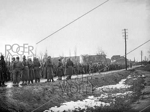 Roger-Viollet | 1421849 | World War II. Column of German prisoners of war walking near Rouffach (France), on February 9, 1945. Photograph fom the collections of the French newspaper  France-Soir . Bibliothèque historique de la Ville de Paris. | &copy; Fonds France-Soir / BHVP / Roger-Viollet