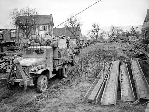 Roger-Viollet | 1421857 | World War II. Convoy crossing the village of Ostheim (France), on February 10, 1945. Photograph from the collections of the French newspaper  France Soir . Bibliothèque historique de la Ville de Paris. | &copy; Fonds France-Soir / BHVP / Roger-Viollet