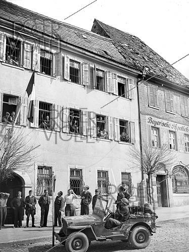 Roger-Viollet | 1421818 | World War II. French flag flying over the Franco-Belgian military camp. Würzburg (Germany), on April 13, 1945. Photograph from the collections of the French newspaper  France-Soir . Bibliothèque historique de la Ville de Paris. | &copy; Fonds France-Soir / BHVP / Roger-Viollet