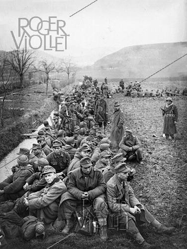 Roger-Viollet | 1421862 | World War II. German prisoners of war at the time of the Liberation of Colmar (France), on February 10, 1945. Photograph fom the collections of the French newspaper  France-Soir . Bibliothèque historique de la Ville de Paris. | &copy; Fonds France-Soir / BHVP / Roger-Viollet