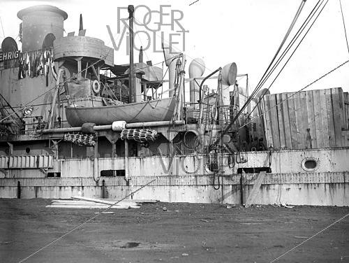 Roger-Viollet | 1421904 | World War II.  Le Havre  Liberty cargo ship transporting food and supplies to help rebuild Europe after the war. France, on February 24, 1945. Photograph from the collections of the French newspaper  France-Soir . Bibliothèque historique de la Ville de Paris. | &copy; Fonds France-Soir / BHVP / Roger-Viollet