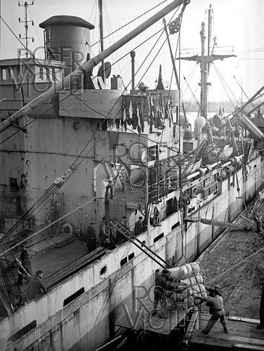 Roger-Viollet | 1421906 | World War II.  Le Havre  Liberty cargo ship transporting food and supplies to help rebuild Europe after the war. France, on February 24, 1945. Photograph from the collections of the French newspaper  France-Soir . Bibliothèque historique de la Ville de Paris. | &copy; Fonds France-Soir / BHVP / Roger-Viollet