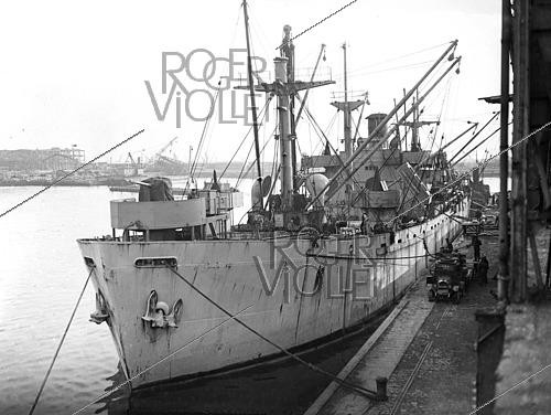 Roger-Viollet | 1421913 | World War II.  Le Havre  Liberty cargo ship transporting food and supplies to help rebuild Europe after the war. France, on February 24, 1945. Photograph from the collections of the French newspaper  France-Soir . Bibliothèque historique de la Ville de Paris. | &copy; Fonds France-Soir / BHVP / Roger-Viollet