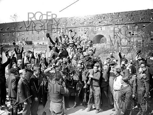 Roger-Viollet | 1421827 | World War II. Liberation of a camp of prisoners of war. Kitzingen (Germany), on April 13, 1945. Photograph from the collections of the French newspaper  France-Soir . Bibliothèque historique de la Ville de Paris. | &copy; Fonds France-Soir / BHVP / Roger-Viollet