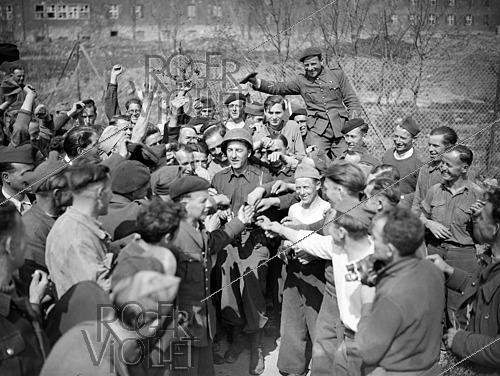 Roger-Viollet | 1421828 | World War II. Liberation of a camp of prisoners of war. Kitzingen (Germany), on April 13, 1945. Photograph from the collections of the French newspaper  France-Soir . Bibliothèque historique de la Ville de Paris. | &copy; Fonds France-Soir / BHVP / Roger-Viollet