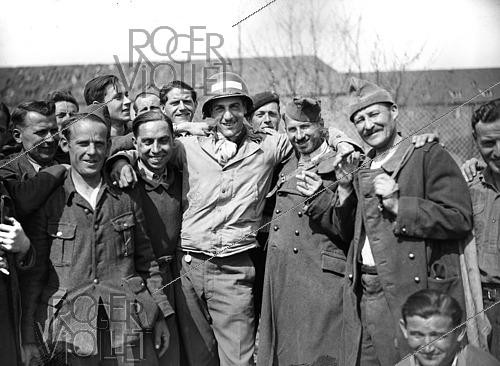 Roger-Viollet | 1421829 | World War II. Liberation of a camp of prisoners of war. Kitzingen (Germany), on April 13, 1945. Photograph from the collections of the French newspaper  France-Soir . Bibliothèque historique de la Ville de Paris. | &copy; Fonds France-Soir / BHVP / Roger-Viollet