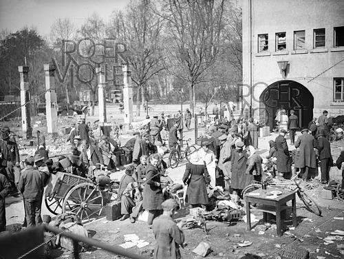 Roger-Viollet | 1421819 | World War II. Street in a Franco-Belgian military camp. Würzburg (Germany), on April 13, 1945. Photograph from the collections of the French newspaper  France-Soir . Bibliothèque historique de la Ville de Paris. | &copy; Fonds France-Soir / BHVP / Roger-Viollet